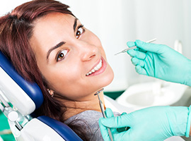 Woman receiving dental services in Brick