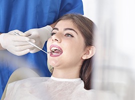 Young woman receiving dental exam