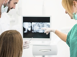Dentist showing a patient their digital dental x rays